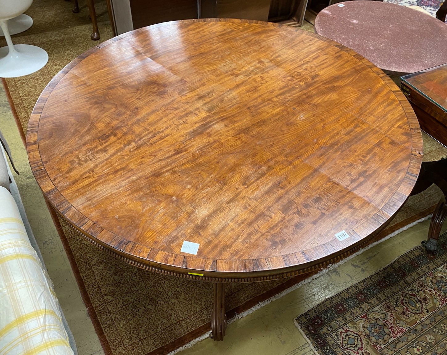 A Regency circular rosewood banded mahogany breakfast table, diameter 130cm, height 70cm